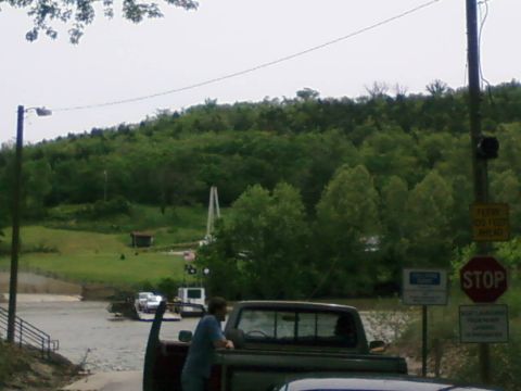 1985 Ford LTD Crown Victoria - A pickup truck is seen from the rear, with a person leaning on its tailgate, at what appears to be a ferry landing.