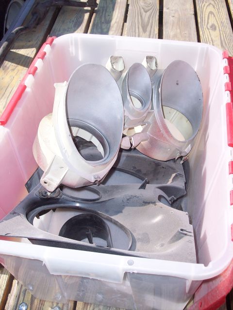 1971 Ford Mustang - A collection of dusty plastic automotive parts are stored in a clear bin, ready for a project.