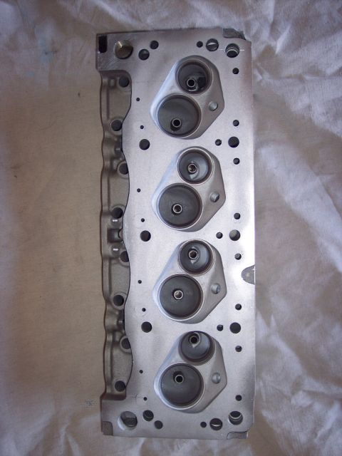 1971 Ford Mustang - Close-up view of an engine cylinder head, showing the ports for intake and exhaust valves.