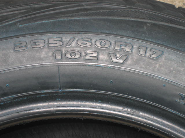 Close-up of tire sidewall showing size 235/60R17 102V
