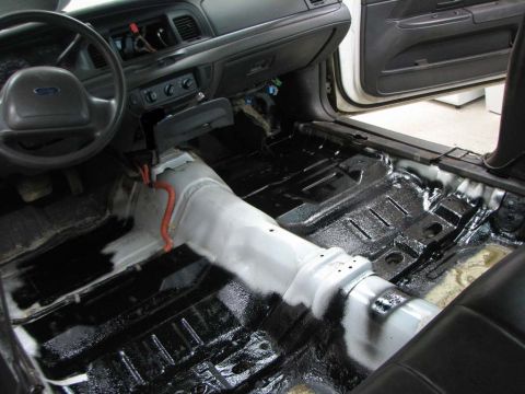2003 Ford Crown Victoria - The interior of a 2003 Ford Crown Victoria shows a stripped floor, ready for audio upgrades.