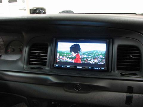 2003 Ford Crown Victoria - Aftermarket infotainment screen installed in a 2003 Ford Crown Victoria dashboard.