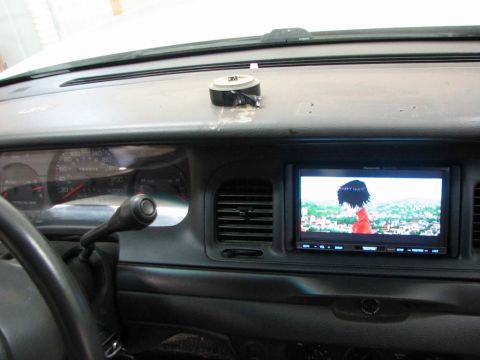 2003 Ford Crown Victoria - The interior of a 2003 Ford Crown Victoria features a dashboard screen playing an anime scene.