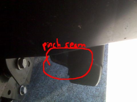 2008 Jeep Wrangler - Low-angle photo under a vehicle's rocker area with a hand-drawn red circle and the label "pinch seam" marking the folded body seam along th…