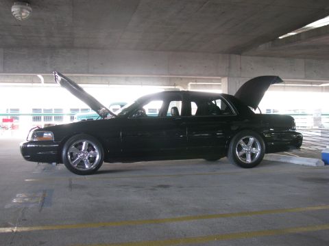 2003 Mercury Marauder - A black 2003 Mercury Marauder is shown with its hood and trunk open in a parking garage.