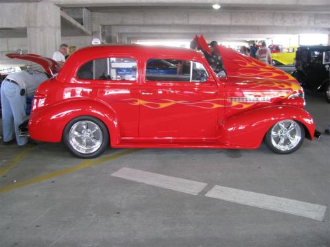 2003 Mercury Marauder - Custom hot rod with flame decals on display at a car show.
