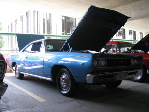 2003 Mercury Marauder - A blue 1968 Dodge Coronet is displayed with its hood open at a car show.