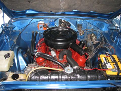 2003 Mercury Marauder - The engine bay of a classic car is shown, a V8 engine and various components.