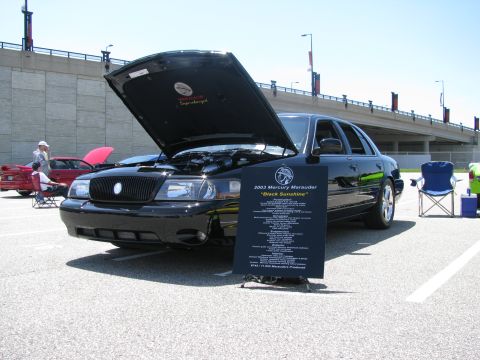 2003 Mercury Marauder - A black 2003 Mercury Marauder is displayed with its hood open at an outdoor event.