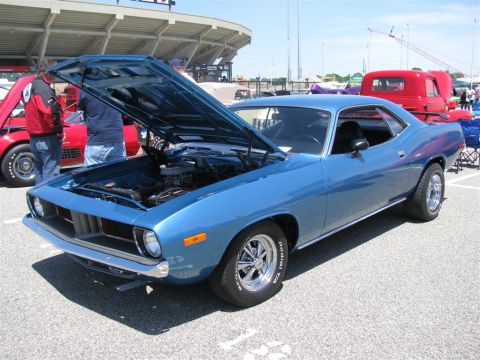 2003 Mercury Marauder - Blue 1970 Plymouth Barracuda coupe at a car show with hood open.