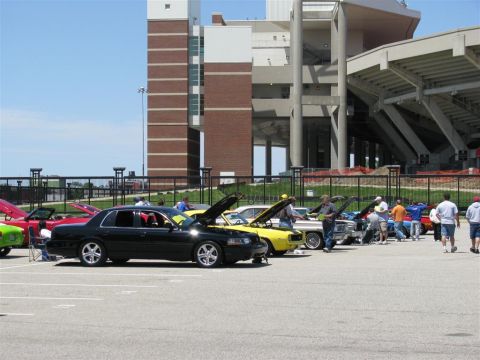 2003 Mercury Marauder - A black 2003 Mercury Marauder is displayed at a car show with its hood open, alongside other vehicles.