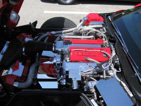 2003 Mercury Marauder - The engine bay of a Corvette features a LT1 Performance engine with polished chrome components and red valve covers.
