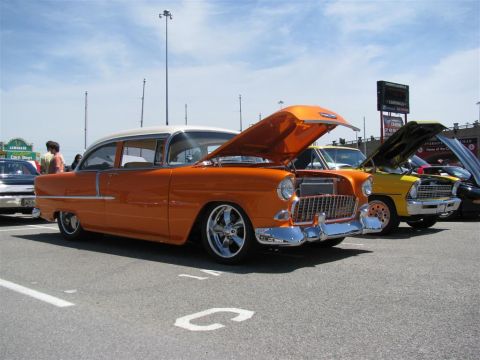 2003 Mercury Marauder - Multiple classic cars are on display at an outdoor event under a partly cloudy sky.