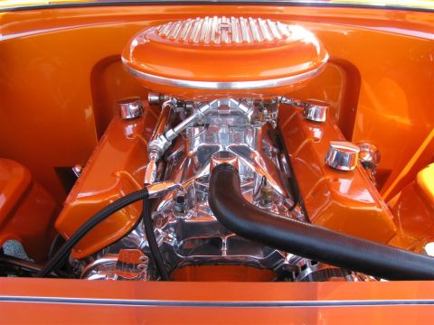 2003 Mercury Marauder - Customized engine bay a prominent chrome carburetor and air intake system, painted in a vibrant orange.