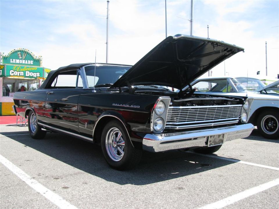 Black 1966 Ford Galaxie 500 convertible front view with hood open