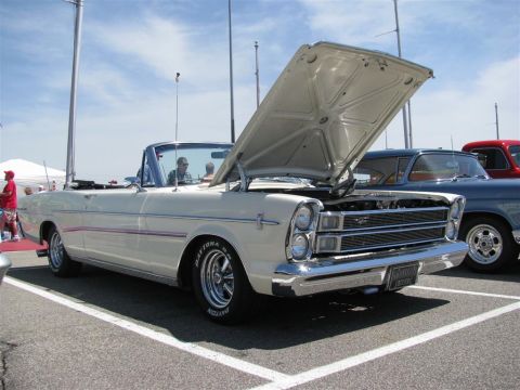 2003 Mercury Marauder - White convertible parked at a car show, hood open, revealing the engine bay.
