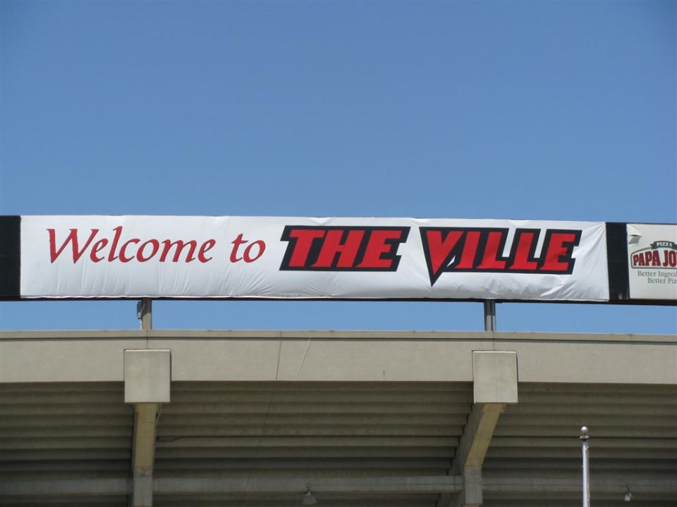 Banner reading "Welcome to THE VILLE" with Papa John's logo