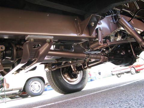 2003 Mercury Marauder - A low-angle view of a vehicle's undercarriage, with another car visible in the background.