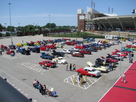 2003 Mercury Marauder - A large gathering of cars at an outdoor event, with a stadium visible in the background.