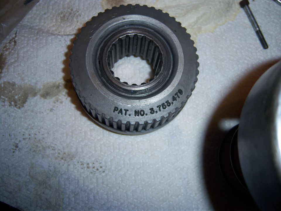 Metal gear with internal splines and "PAT. NO. 3.765.479" stamped on its side