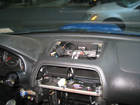 2007 Subaru Impreza - The dashboard of a car is shown with the center console removed, revealing wiring and electronic components.