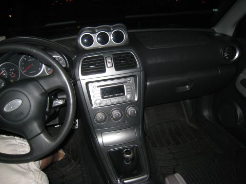 2007 Subaru Impreza - Interior view of a 2007 Subaru Impreza, highlighting the dashboard and center console.