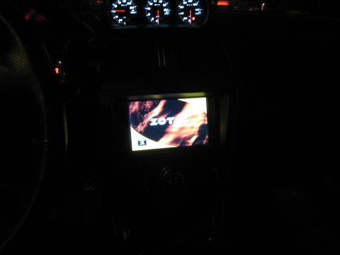 2007 Subaru Impreza - The dashboard of a car at night displays illuminated gauges and a screen with the text "ZOT".
