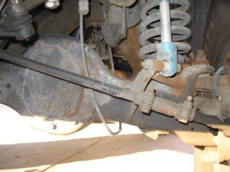 1984 Ford Bronco - Undercarriage view shows the differential housing and suspension system of a vehicle.