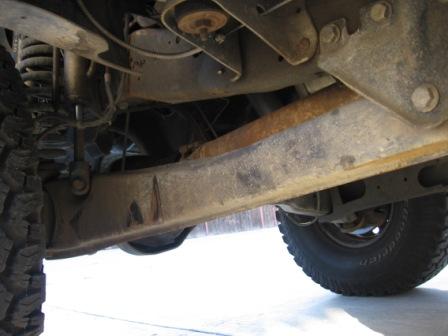 1984 Ford Bronco - The undercarriage of a 1984 Ford Bronco reveals its robust suspension and frame components.