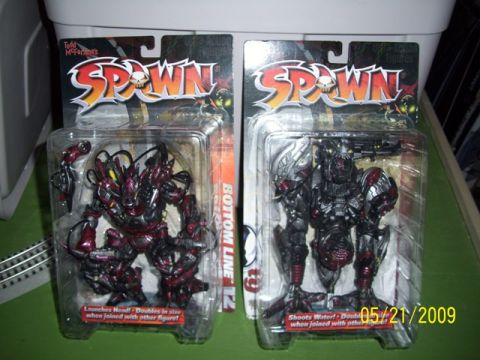 1991 Ford Bronco - Two Todd McFarlane's Spawn action figures are displayed in their original packaging, with a date stamp of 05/21/2009.
