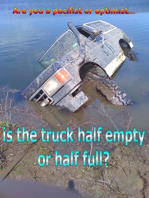 1990 Ford Bronco - A vehicle is submerged in water, prompting a philosophical question about perspective.