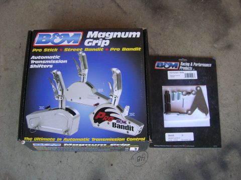 1996 Ford Bronco - Two B&M automatic transmission shifters are displayed, one in its original packaging and another as a separate part with hardware.