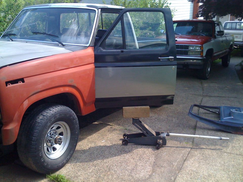 Using a floor jack to install a door by yourself