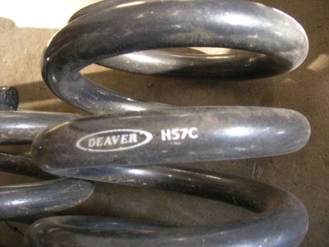1996 Ford Bronco - A close-up view of a Deaver coil spring with part number H57C visible.