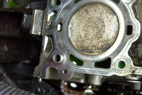 1997 Ford Taurus - This is a close-up view of an engine's cylinder head gasket and a piston.
