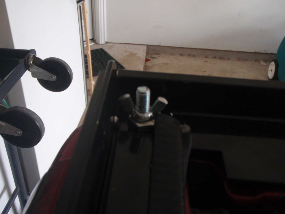Wing nut fastener on black surface