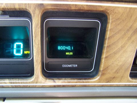 1987 Lincoln Mark VII - Interior view of a digital dashboard with odometer and speedometer readings.