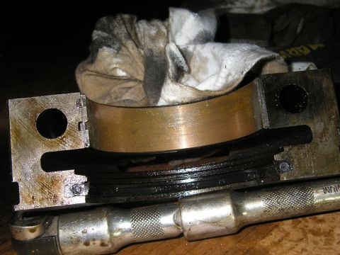 1979 Ford Bronco - Close-up view of an engine bearing assembly, likely undergoing maintenance or repair.