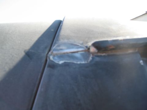 1986 Ford Bronco - Detail of a welded seam on the roof of a vehicle.