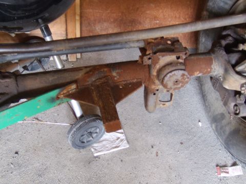 2002 Jeep TJ - Close-up view of a heavily rusted axle assembly, likely from an older vehicle.