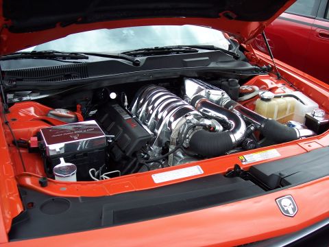 1972 Ford Ranchero - The engine bay of a modern car, a supercharged V8 engine and a distinctive skull emblem.