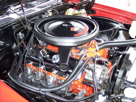 1972 Ford Ranchero - Close-up view of a V8 engine, likely from the early 1970s, with prominent orange valve covers.