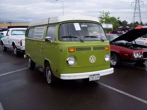 1972 Ford Ranchero - A green 1972 Volkswagen Type 2 camper van is parked next to other vehicles.