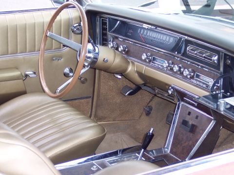 1972 Ford Ranchero - The dashboard of a vintage car features a speedometer, radio, and various controls, with tan upholstery throughout.