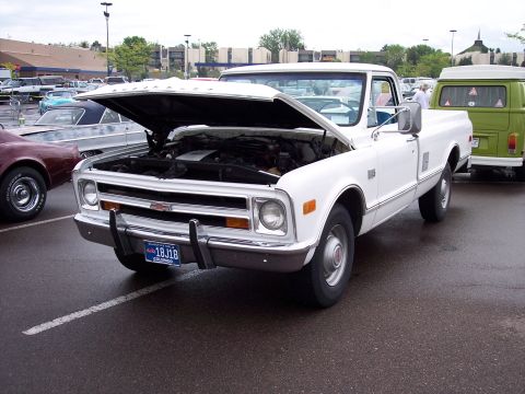 1972 Ford Ranchero - This white pickup truck, likely a 1971 model, is parked with its hood open. A Colorado license plate is visible.