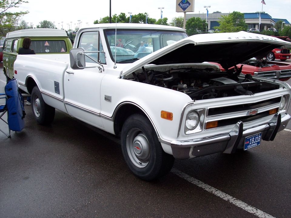 White 1971 Chevrolet pickup truck, hood open, showing engine. Colorado license plate 18J18