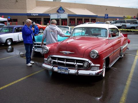 1972 Ford Ranchero - A red and white 1953 Chevrolet Bel Air is parked in a lot, with other classic cars visible.