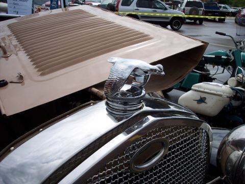 1972 Ford Ranchero - A chrome bird hood ornament is the focal point of this close-up shot of a vintage car's front end.