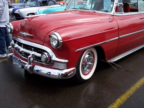 1972 Ford Ranchero - Front view of a red 1953 Chevrolet Bel Air coupe, parked outdoors.