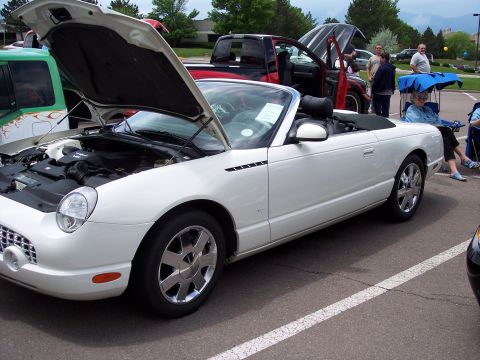 1972 Ford Ranchero - A white 2002 Ford Thunderbird convertible is displayed with its hood open, revealing the engine compartment.